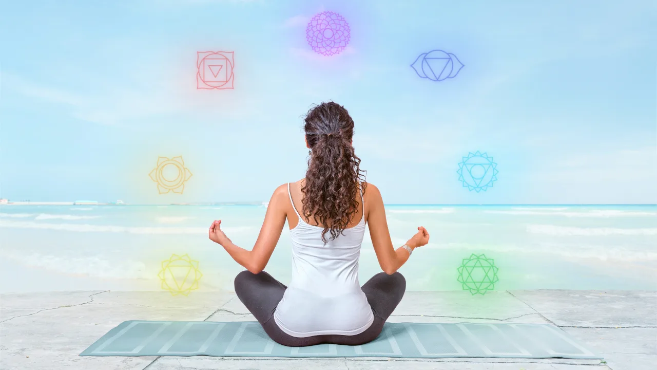 Illustration of 7 chakras aligned along the spine in a human silhouette, representing energy centers for balance and healing